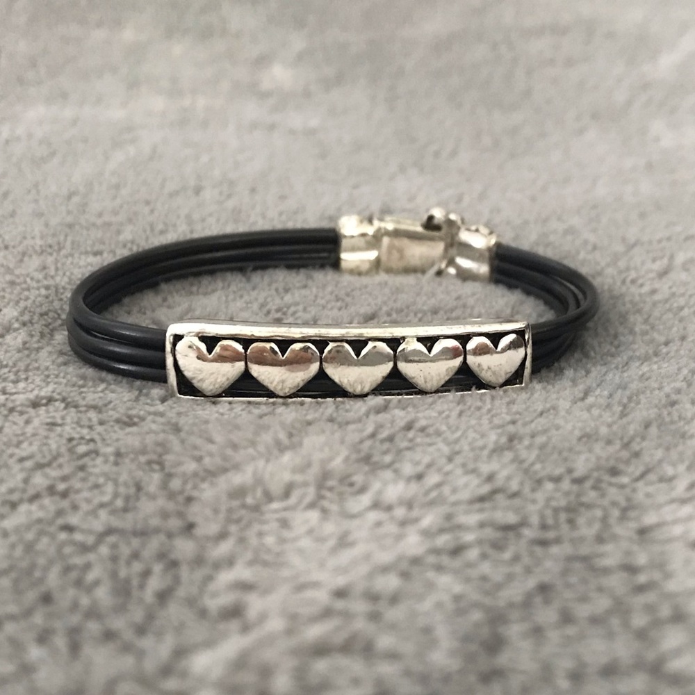 Black bracelet with silver hearts